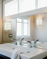 Attaching the Alhambra 12x12 Sconce directly to the bathroom mirror is great when space isn't available on the walls. #lighting #sconce #bathroom #BoydLighting