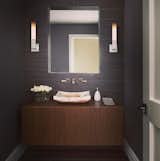 The fluorescent Linea Sconce comes in Gossamer Aluminum and sports a simple bent metal elbow that supports a square, cased white glass diffuser. ADA. Can be powder coated to match any interior. Interior design by Carrie Long Interiors. Photo by Beth Singer. #sconce #bathroomsconce #lighting #lightingdesign