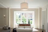 This classic drum ceiling pendant by Michael Vanderbyl for Boyd Lighting is a perennial best seller. Available in five sizes and three metal finish options. #livingroom #livingroomlighting #pendant #livingroompendant #drumshade #drumpendant #lighting