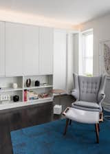 Shop lacquered cabinet hides the TV and books, while offering a nice display area for prized ceramics and trinkets
