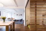 Open Living and Dining space with the teak slat screen wall defining the office space to the right