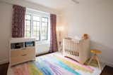 Sweet nursery room with colorful curtains 