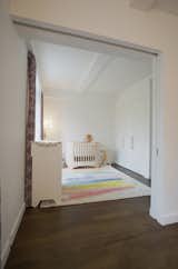 Large 7' pocket door connects the two children's bedrooms creating a large play area between the two