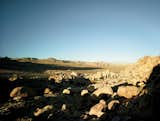 As seen from behind, the concrete “wings” of the Kendrick Bangs Kellogg-designed organic modern house, embedded in a five-story mound of rounded boulders on the edge of Joshua Tree National Park in the California desert. Credit Photograph by Anthony Cotsifas. Produced by Michael Reynolds

Originally from NYTimes article "Rock Legend" http://www.nytimes.com/2015/05/14/t-magazine/joshua-tree-house-kendrick-bangs-kellogg.html#

#joshuatree #desert #california #kendrickbangskellogg