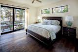 Bedroom, Bed, and Dark Hardwood Floor  Photo 2 of 7 in Muskoka-style luxury home by BONE Structure