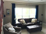 This client needed help accessorizing their Living room, I added the blue drapes, art, pillows and chair in this photo. 