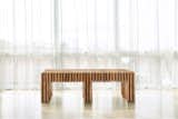 This particular bench was made from 128 individual pieces of wood joined invisibly to create the final form.