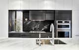 Steel and slate define the "Fire" zone of the cooking area. 