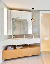 Hidden lighting appears through surfaces in the master bath.   