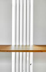 A band of oscillating slatting runs four storeys connecting spaces along the entire house. 