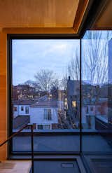 Mezzanine corner with view over neighbourhood.   Photo 7 of 15 in Black Metal Steels the Show at This Renovated Live/Work Space in Toronto from House Studio