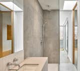 Bath Room, Engineered Quartz Counter, Porcelain Tile Floor, Open Shower, Undermount Sink, Ceramic Tile Wall, and Porcelain Tile Wall Ensuite bathroom at mezzanine.   Photo 10 of 15 in Black Metal Steels the Show at This Renovated Live/Work Space in Toronto from House Studio