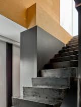 Staircase and Metal Tread Blackened steel stair rising to mezzanine.   Photo 3 of 15 in Black Metal Steels the Show at This Renovated Live/Work Space in Toronto from House Studio