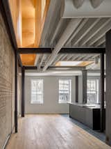 Kitchen Main living area with voids open to mezzanine above.  Photo 4 of 15 in Black Metal Steels the Show at This Renovated Live/Work Space in Toronto from House Studio