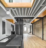 Main living area with voids open to mezzanine above.  Photo 6 of 15 in Black Metal Steels the Show at This Renovated Live/Work Space in Toronto from House Studio