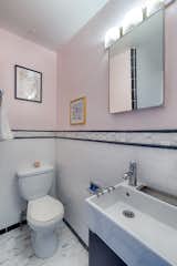 The small 3/4 ensuite bath in the primary bedroom.