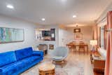 The living areas of this traditional post-war ranch home was opened way up to create a contiguous living space from the living room to the kitchen in back of the house.
