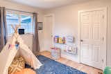 This play room, the homes’s original third bedroom, is connected to the kitchen through a small powder room; an original feature of the house and an unusual feature for a post-war ranch home.