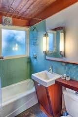 The home’s one bathroom carries on the same vintage fit-and-finish as the rest of the house.