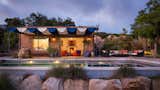 Cabaña. Pool exterior using Paul's Flower Tile.  Photo 6 of 13 in Lit Up Homes in the Evening by Jennifer Ann Gagnon from La Roca