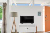 The living room in Unit 3 featuring a flat screen Smart TV and Bludot credenza.