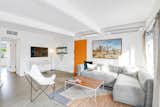 A Bludot corner sectional provides a cozy corner to watch TV. Original art by Jaime Kowal.