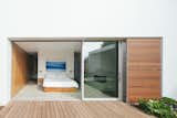Bedroom, Concrete Floor, Bed, Recessed Lighting, and Night Stands  Photo 7 of 13 in Minimalist Urban Residence by ANACAPA