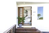 Outdoor, Horizontal Fences, Wall, Wood Fences, Wall, Front Yard, and Wood Patio, Porch, Deck Entrance  Photo 13 of 27 in The Live Oak House by Mandy Cheng Design