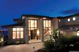 Ultra Series windows form a large wall of glass for a dramatic façade. Wide sidelites expand the view with an open, inviting appearance.  Kolbe Windows & Doors’s Saves from Luxurious Landscape | Kolbe Windows & Doors