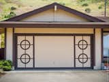 I think a submarine captain lives here.  Photo 19 of 29 in Real Garage Doors Don’t Fold by Remarkablearchitecture