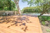 This project uses a revolutionary PVC product called Zuri Premium Decking which has the low maintenance of a composite plus the look of real wood. It looks amazing coupled with this custom pool!   Photo 11 of 11 in A Pool In Austin Built For Relaxing by TimberTown