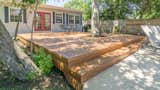 When dealing with a project that has uneven sun exposure, a composite decking product is a good option since the best composites come with 25 year stain or fade warranties. This deck is Zuri Premium Decking, which uses a proprietary process to create an 100% PVC board that looks just like real wood. 