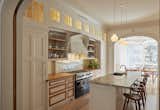Kitchen designed by architect Louis Mackall. Cabinet fabrication by James Schriber Furniture. Tile backsplash by Mosaic House in NY, specializing in Moroccan Tiles. 

Architect Louis Mackall designed two archways, with custom arched pocket doors from Breakfast Woodworks for the parlor opening.