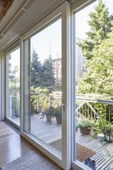 An expansive, Zola three-panel lift slide door spans nearly the entire width of the house, illuminating the whole floor. The rear facade is southern-facing, and the spacious dining room provides an ideal location for placement of this large opening.

http://www.zolawindows.com/thermoclad/