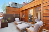 Outdoor Deck features Zola Lift & Slide Door offering outstanding thermal and acoustic performance while showcasing expansive views of downtown Manhattan.