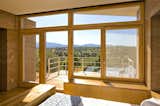 "The high desert sun in this part of the country makes for incredible sunrises and sunsets, but it is also a design challenge. We studied the sun patterns before putting a single stroke on the drawing board. You must find the sweet spot between combating extreme heat in the summer days, that is, controlling the heat gain in the summer, and also creating a comfortable interior during the cold nights. The roof has substantial overhangs sheltering the structure from the elements and shading the home’s glazing from the sun. The climate and geography of Santa Fe make it a challenging and exciting canvas to work with. We approached site selection through the lens of opportunity rather than challenge: we chose a location along a ridge to maximize access to the sun. The location also carefully tucks the home’s decks and outdoor living space out of the line of the winds, which can be very strong in Santa Fe." Graham Hogan, AIA, LEED of Studio GP LLC

Zola Thermo Clad Lift & Slide Door