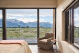A Lift & Slide Door from Zola Windows opens directly from the master bedroom onto the sage brush landscape that surrounds the home.