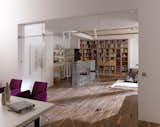 This modern barn door is separating the living room from dining area, creating an active room divider while not blocking light from entering. Get inspired -> www.bartelsdoors.com