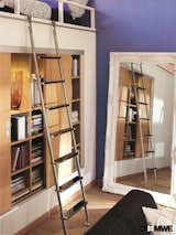 Bartels sliding ladder being used in a loft-style apartment. 