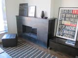 Hot rolled steel cladding for fireplace surround. Finished with clear satin.