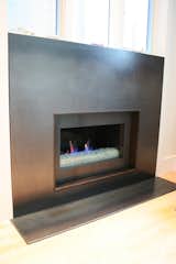 Hot rolled steel fireplace surround with clear satin finish