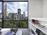 View of the San Francisco skyline from the Sun Room. The bookcase also acts as a guardrail for the stairway.