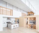 Kitchen, White, Light Hardwood, Concrete, Ceiling, Track, Recessed, Accent, Subway Tile, Refrigerator, Range, and Range Hood Kitchen and living space looking toward studio and loft bedrooms  Kitchen Range Hood Light Hardwood Ceiling Accent Recessed Range Photos from Inspiration