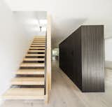 Entryway with stair and storage container/ room divider