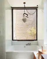 Primary bathroom tub looking toward outdoor shower
