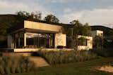 River side view of house at sunset