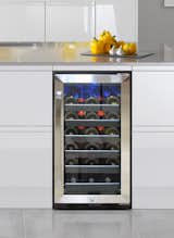 Vinotemp 30 Bottle Single Zone Wine Cooler (SKU: VT-32SBB)

This Vinotemp cooler makes the perfect, stylish way to store your finest bottles of wine. The black wire racking with black wooden lip cradles your collection behind a glass door with stainless steel trim. Soft blue interior LED lighting showcases your wine, making it easy to select which wine to serve next. An easy-to-use digital temperature control panel makes it simple to keep your wine at the ideal serving temperature. This cooler is equipped with front exhaust making it perfect for built-in installation. This 30 bottle wine cooler has a sleek, elegant design that will give your wine collection the distinction it deserves.
