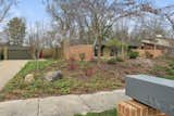 View from curb including integrated mailbox with garden walls