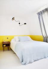 As a paint color, chartreuse can really make a space pop. Playing off soft blue bedding and bright white walls and floor, the yellow hue adds an element of whimsy to a minimal bedroom design.

Photo courtesy of Hotel Henriette

#chartreuse #colorcrush #color #yellow #design #mydomaine