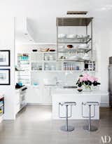 Display Your Pots

Don't waste valuable cupboard space in small kitchens by storing your pots and pans. Use a decorative rack or series of hooks to relocate and display your bulkiest items. This will free up closed-door space for other, less attractive kitchen essentials.

Photo by William Abranowicz for Architectural Digest
Design by Vicente Wolf

#design #smallspace #storage #mydomaine